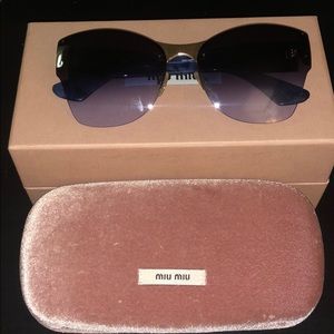 Miu Miu sunglasses in “like new” condition.